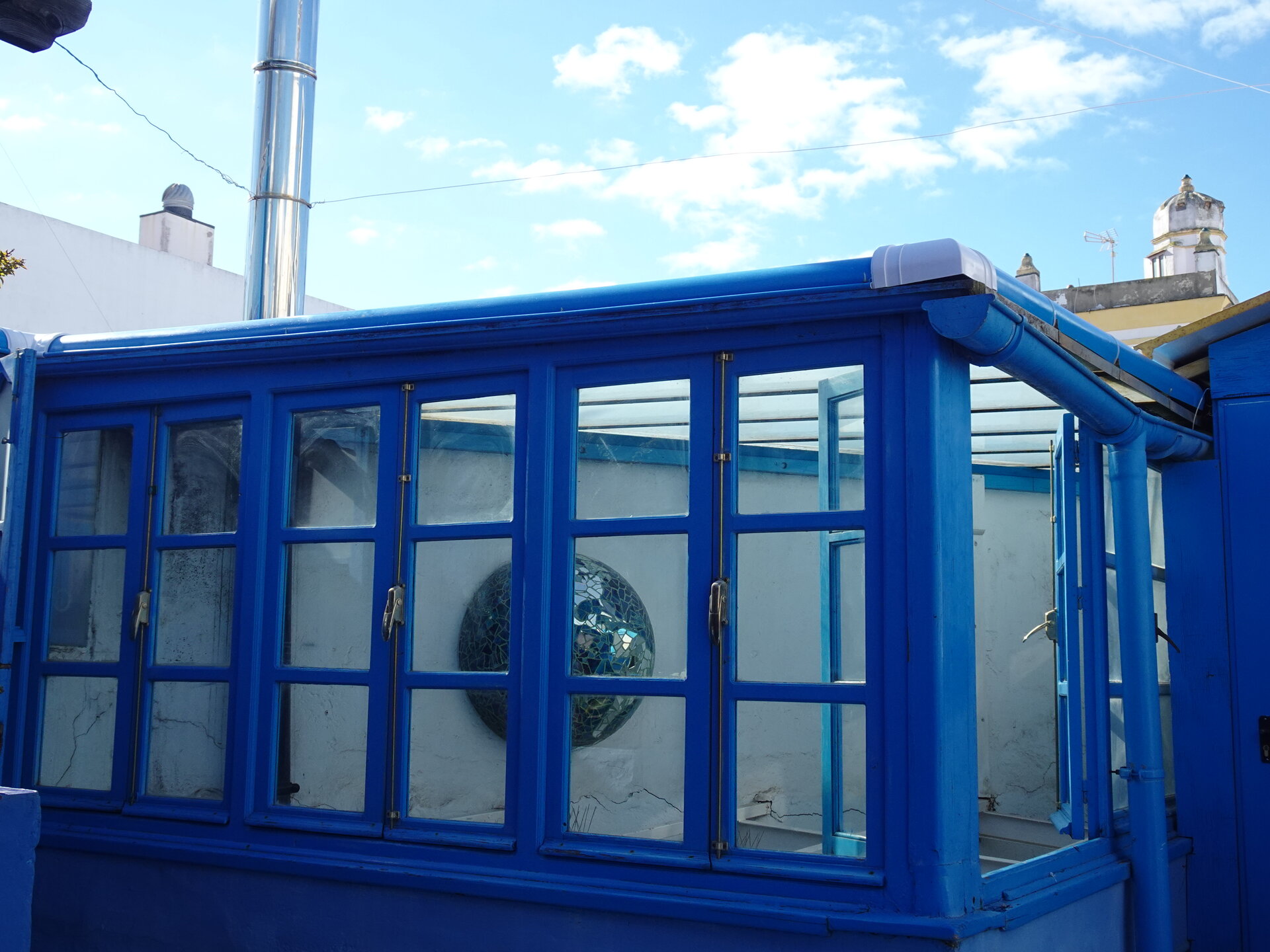 Blue glass conservatory on a rooftop