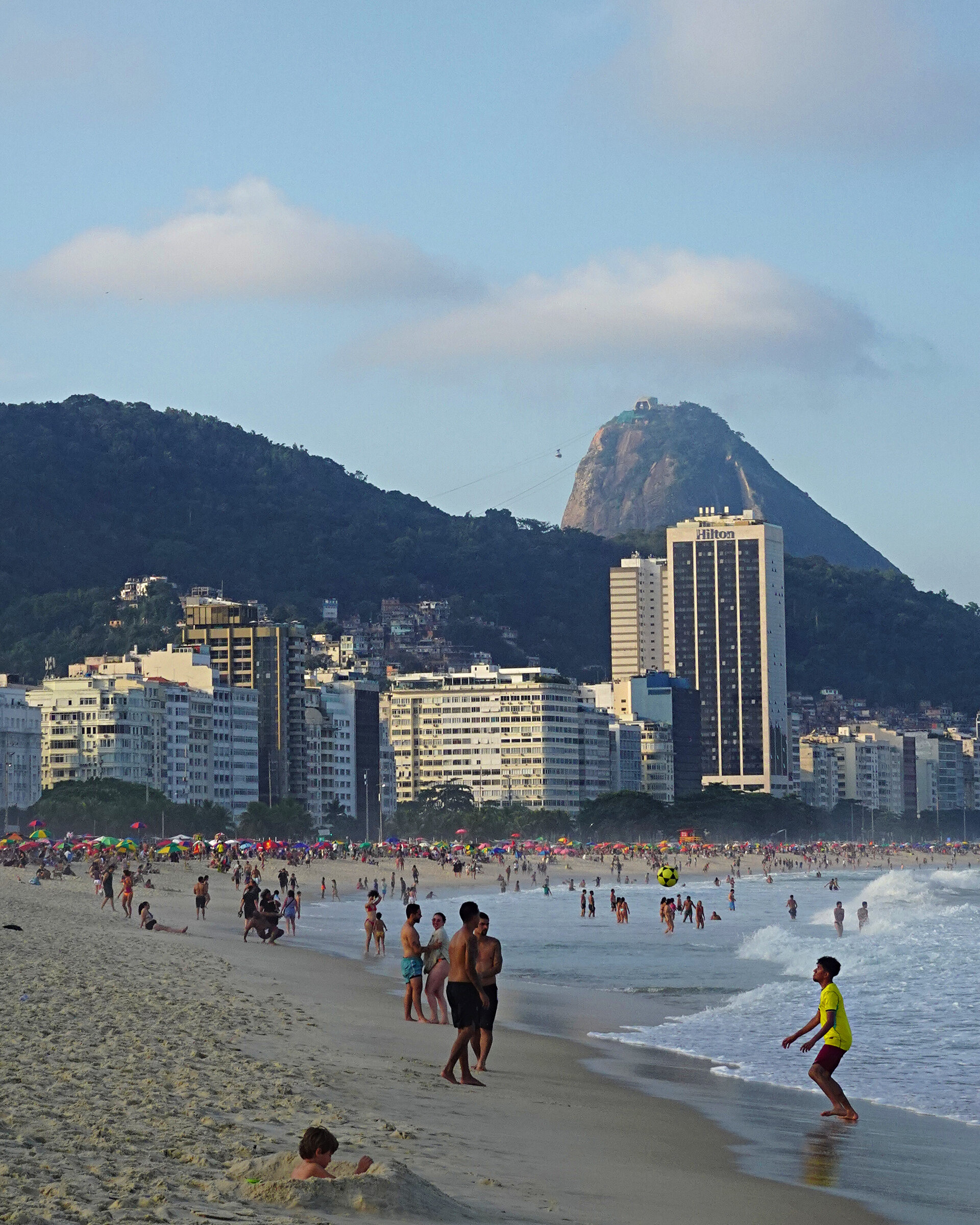 Sugarloaf Mountain rising behind the Copacabana seafront at the end of the day