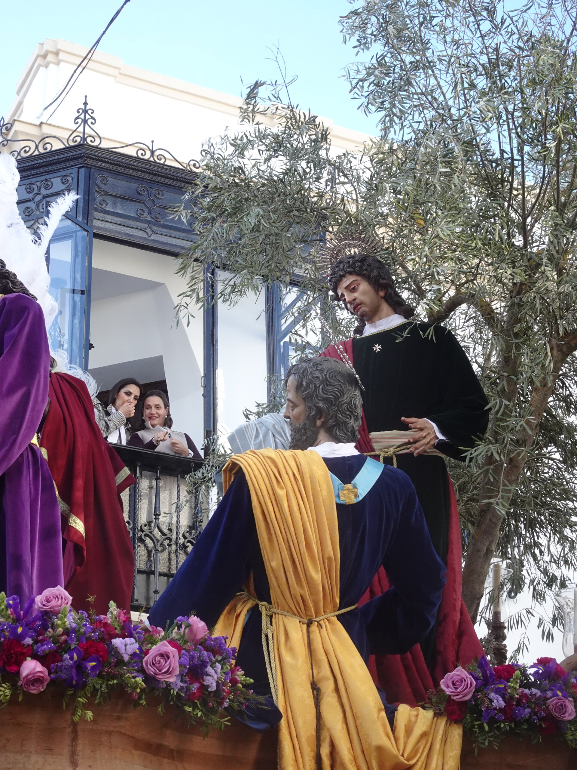 Religious float with biblical figures and an olive tree